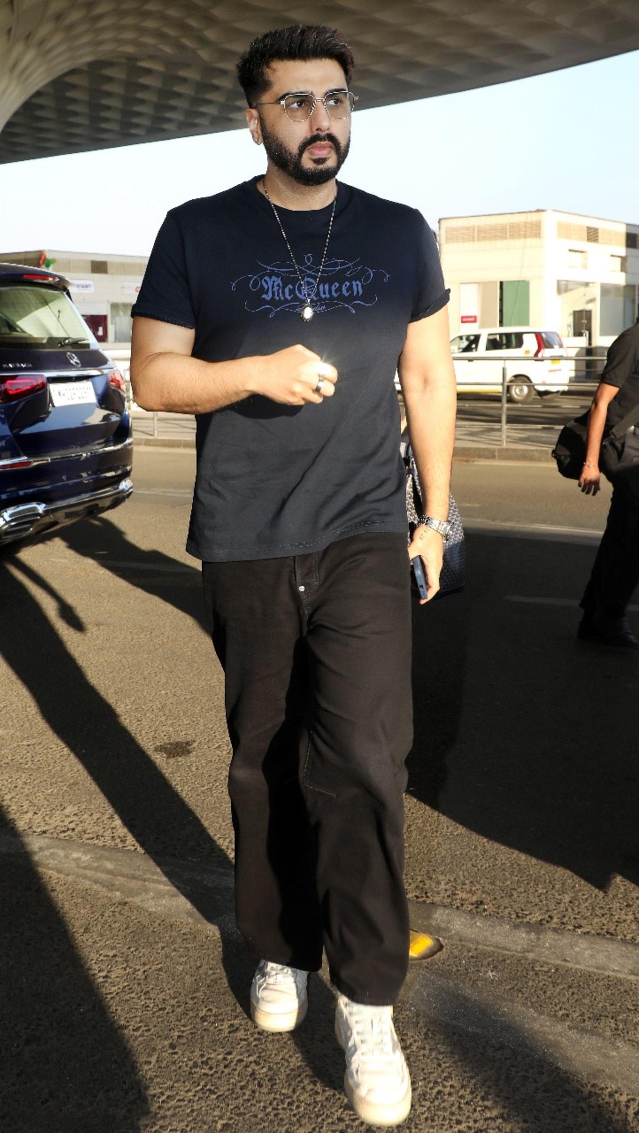 Arjun Kapoor was papped at the airport early on Tuesday morning as he headed out of the city in black t-shirt and black track pants.